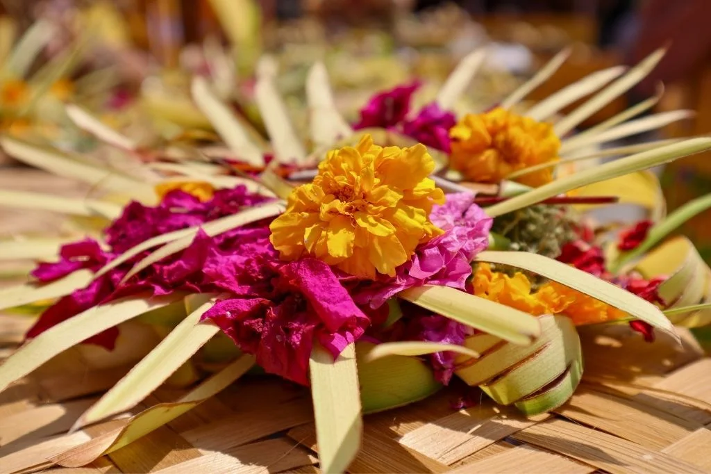 A close-up of a beautiful, handmade Canang Sari, the daily Balinese offering to the gods.